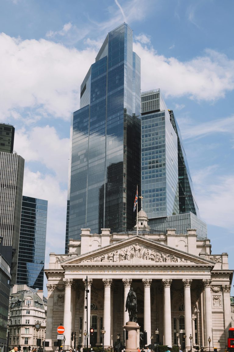 View of The Royal Exchange and modern skyscrapers in London's skyline.